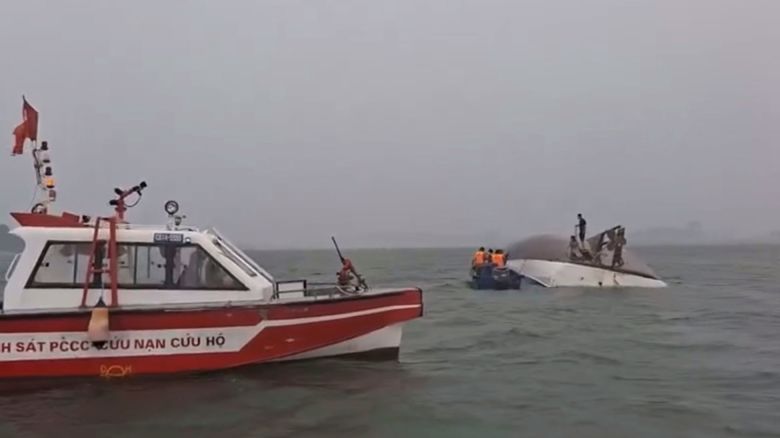 Survivors clung to the capsized tourist boat for hours before being rescued in Ha Long Bay, Vietnam on Saturday.