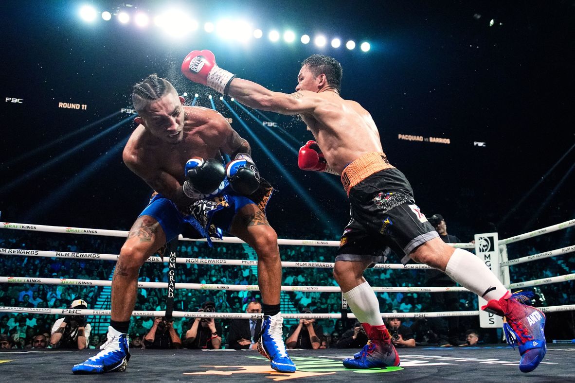 Mario Barrios, left, tries to avoid a punch from Hall of Fame boxer Manny Pacquiao during their welterweight title bout in Las Vegas on Saturday, July 19. Pacquiao, 46, was making his first appearance in the ring in nearly four years. He fell just short of taking the title of Barrios, <a  target="_top" href="/newspapers?url=https://www.cnn.com/2025/07/20/sport/pacquiao-comeback-barrios-boxing-hnk">who retained the WBC belt with a majority draw</a>.