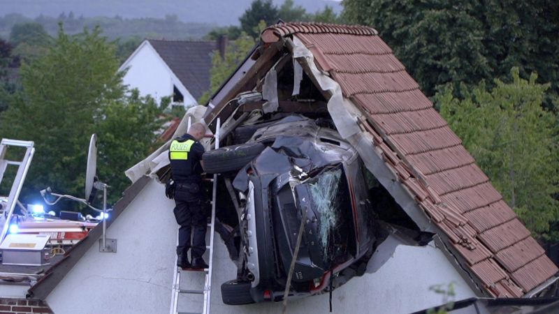 Car flies through air, landing in barn roof in Germany, seriously injuring two Car flies through air, landing in barn roof in Germany, seriously injuring two