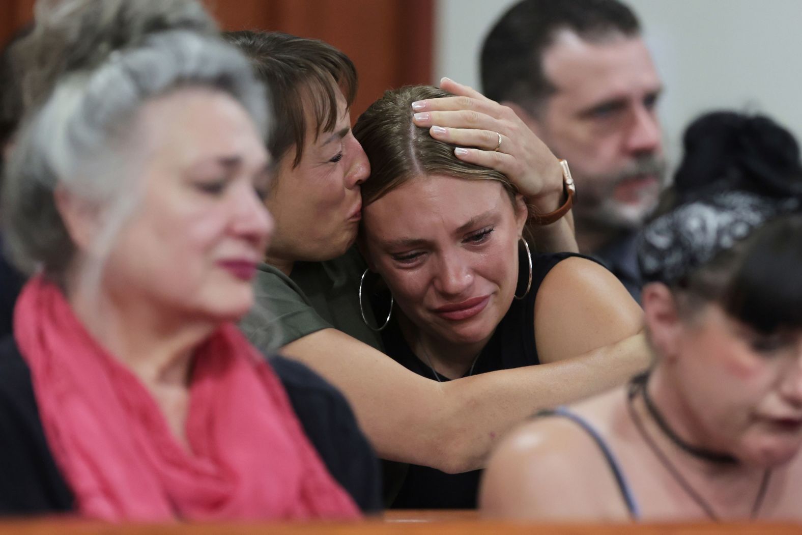 Dylan Mortensen gets a hug after speaking at the sentencing hearing of Bryan Kohberger at the Ada County Courthouse in Boise, Idaho, on Wednesday, July 23. Kohberger, who murdered four University of Idaho students in 2022, <a href="index.php?page=&url=https%3A%2F%2Fwww.cnn.com%2F2025%2F07%2F24%2Fus%2Fbryan-kohberger-documents-idaho-murders">was sentenced to life in prison without parole</a>.