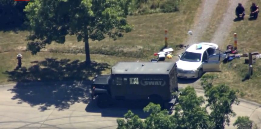 Aerial image from a video provided by WEWS shows police working at the scene were officers were wounded and a man was killed in an exchange of gunfire on Wednesday in Lorain, Ohio.