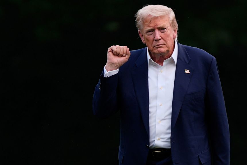 President Donald Trump walks from Marine One after arriving on the South Lawn of the White House, on Tuesday.