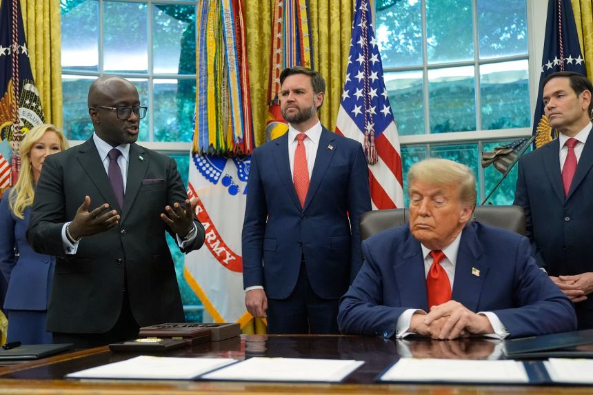 US President Donald Trump listens as Rwanda's foreign minister Olivier Nduhungirehe speaks during an event in the Oval Office at the White House in Washington, on June 27.