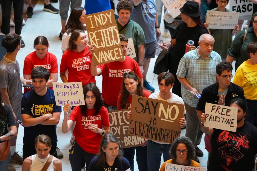 Protestors cheer during a really against redistricting at the Indiana Statehouse in Indianapolis, Thursday, August 7, 2025.