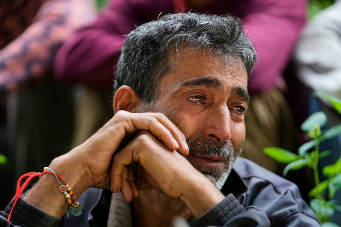 Hari Chand mourns the death of his wife during flash floods in Kashmir, on Friday.