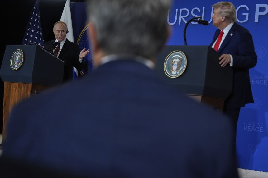 President Donald Trump listens as Russia's President Vladimir Putin speaks during a news conference at Joint Base Elmendorf-Richardson, Alaska, on Friday, August 15, 2025.