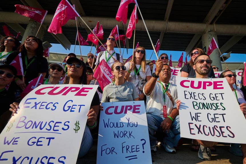 Air Canada flight attendants picket at Pearson International Airport in Toronto on Saturday, Aug. 16, 2025.