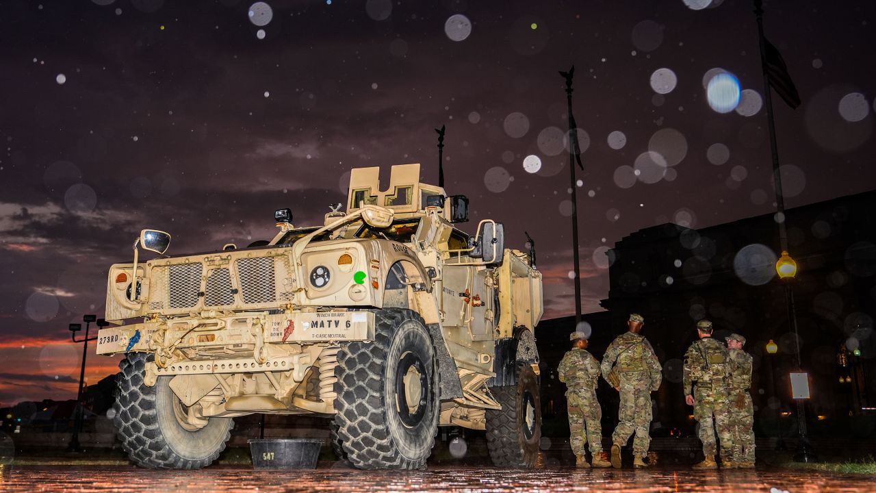 Members of the DC National Guard stand next to their M-ATV outside Union Station, on Sunday.
