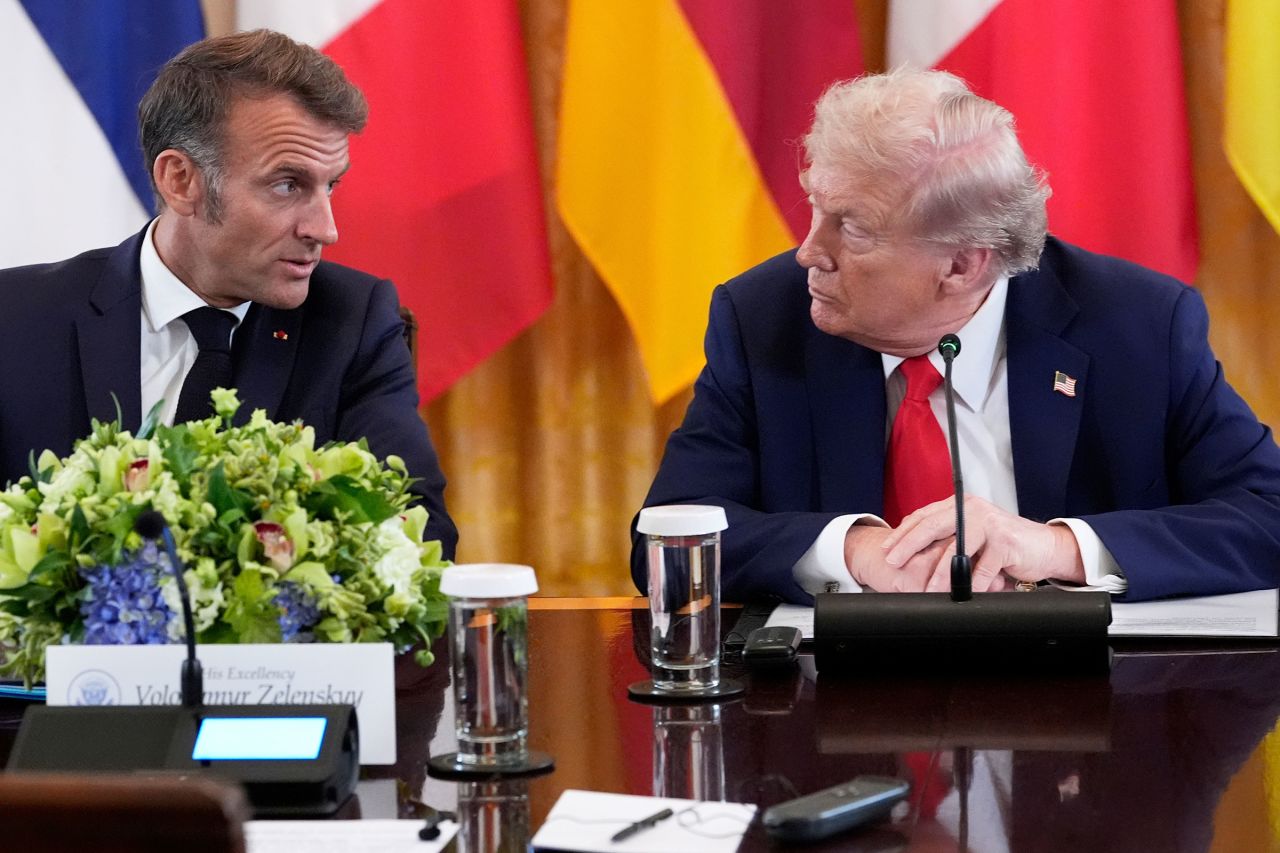 France's President Emmanuel Macron and President Donald Trump speak during a meeting.