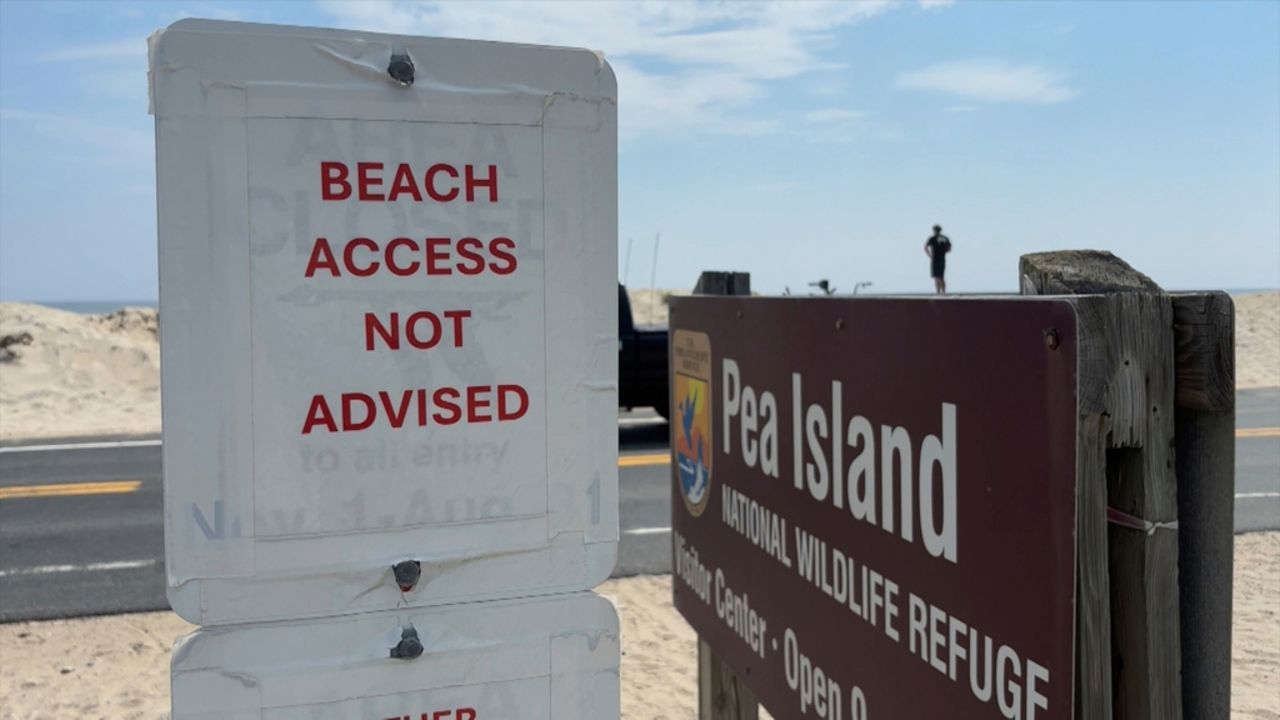 A sign warning against beach access is posted in Dare County, North Carolina on Monday.