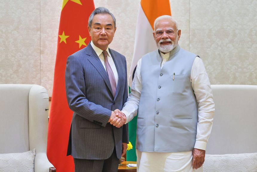 Indian Prime Minister Narendra Modi shakes hand with Chinese Foreign Minister Wang Yi in New Delhi, India, Aug.19, 2025.
