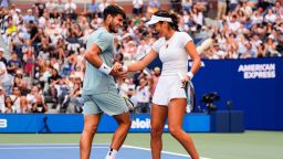 Carlos Alcaraz, left, of Spain, and Emma Raducanu, of Great Britain, celebrate during their mixed doubles match at the U.S. Open tennis championships in New York City on August 19, 2025.