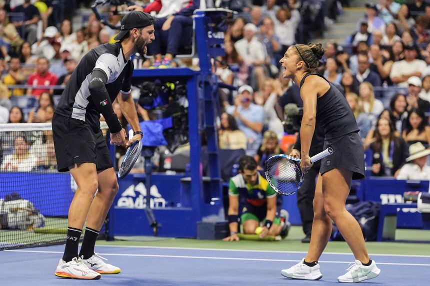 Errani and Vavassori celebrate winning match point in their mixed doubles semifinal.