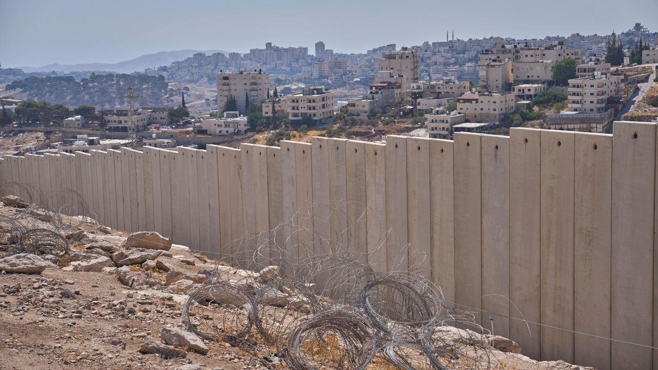 The separation wall next to the Arab neighbourhood of Al-Eizariya, near where the Israeli government says housing units will be built as part of a new settlement project.