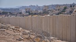 The separation wall next to the Arab neighbourhood of Al-Eizariya, near where the Israeli government says housing units will be built as part of a new settlement project.