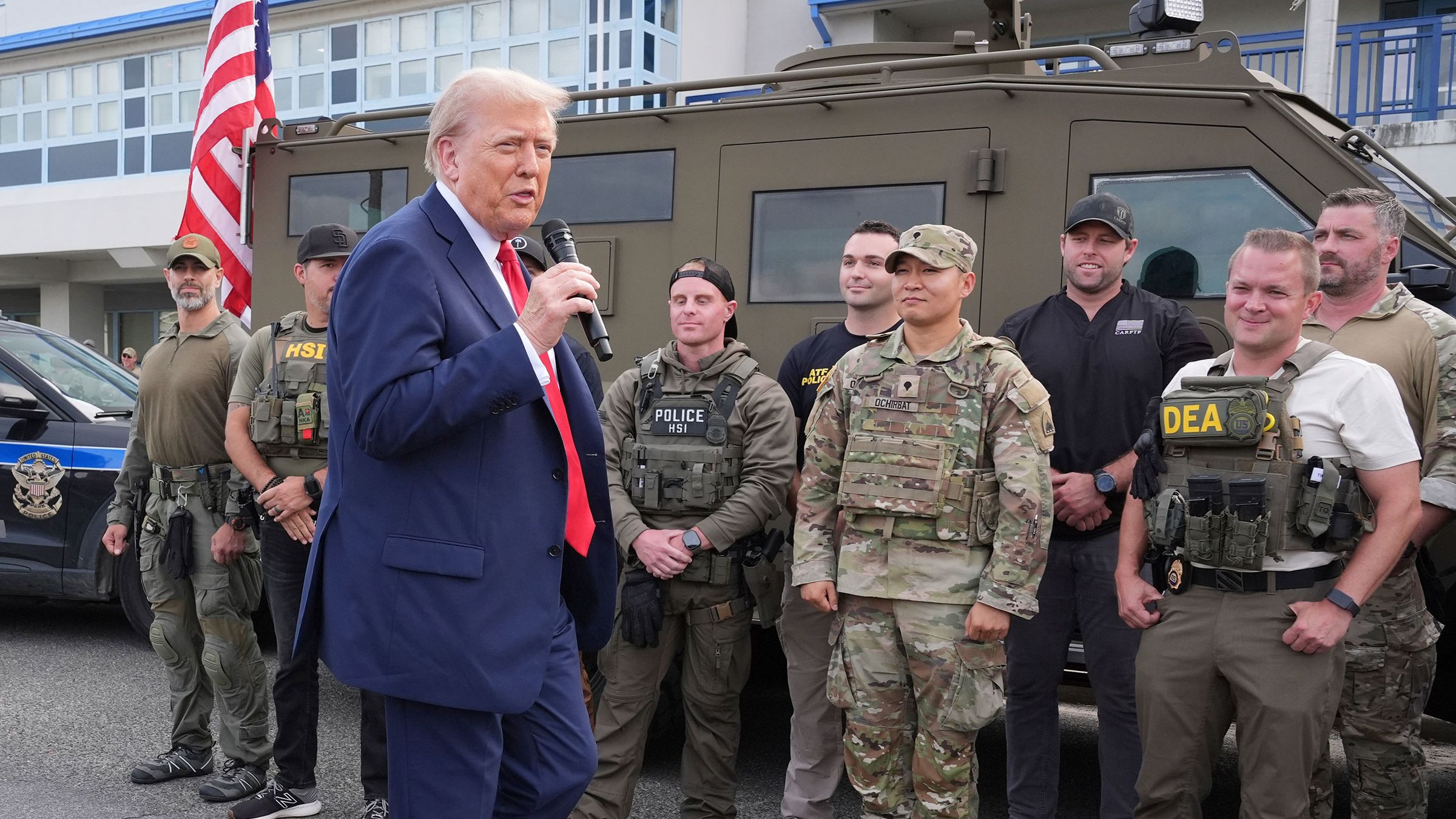 Trump says law enforcement crackdown will ‘go on to other places’ during appearance at police facility in DC