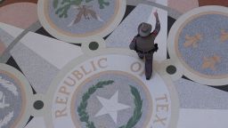 A Texas troopers passes the Texas Seal in the Rotunda of the Texas Capitol before debate on a bill on a redrawn U.S. congressional map during a special session in the Senate Chamber in Austin, Texas, Friday, Aug. 22, 2025. (AP Photo/Eric Gay)