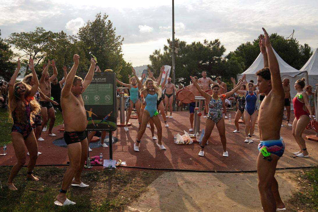 Competitors warm up before the start of the event.