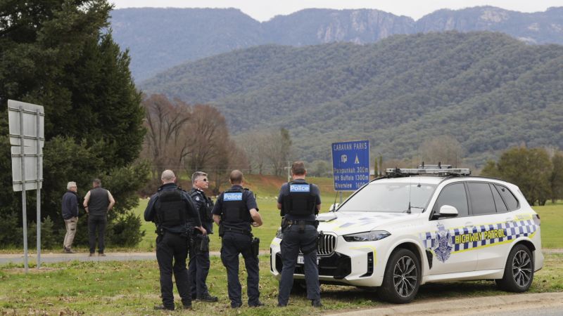 Australian police hunt gunman who shot dead two officers in rural town