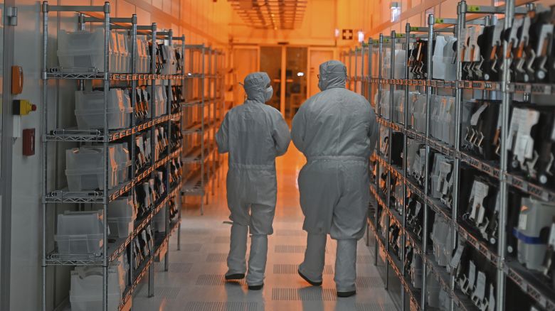 Employees of Nexperia GmbH walk through the semiconductor manufacturer's clean rooms on August 25, 2025 in Hamburg, Germany.