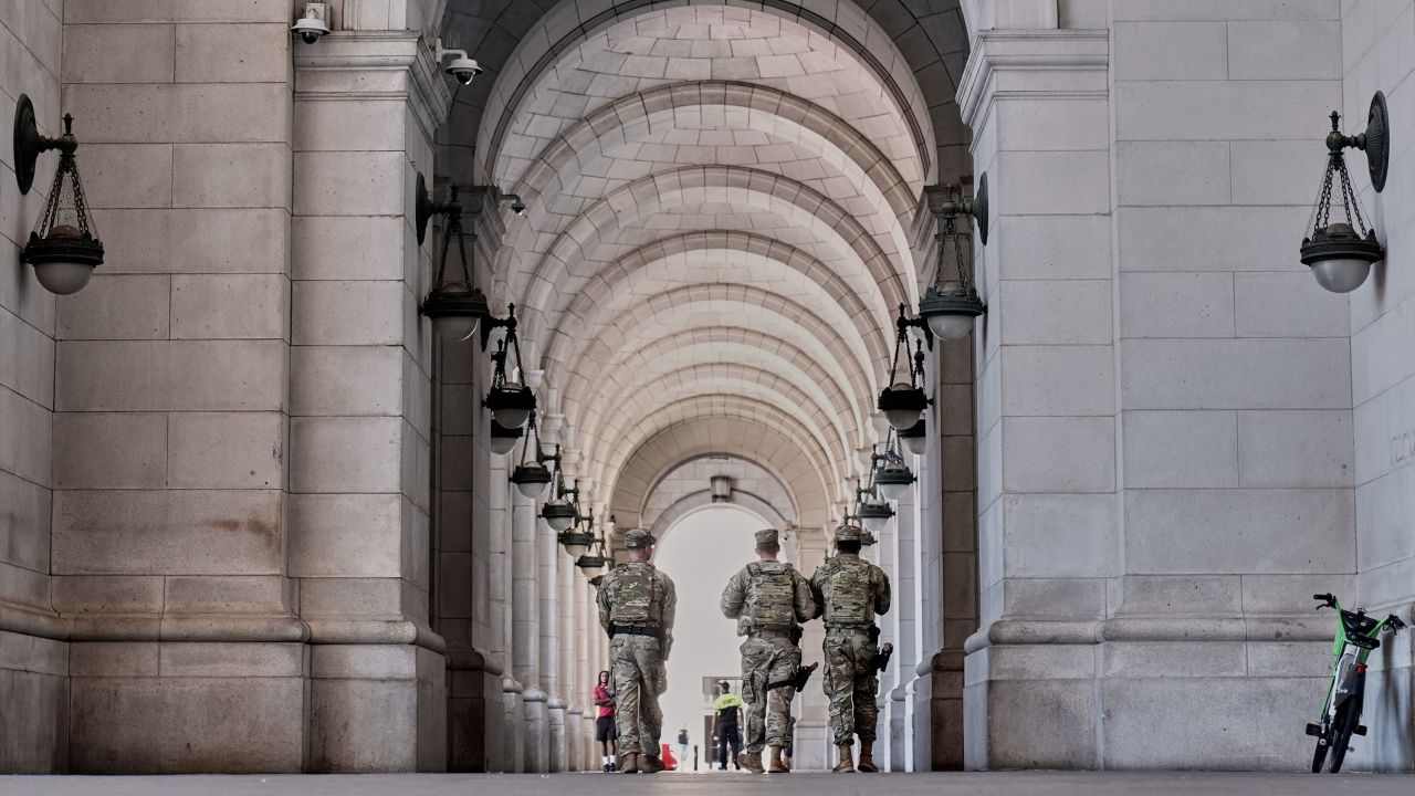 Armed members of the National Guard patrol Union Station, in Washington, DC on Tuesday.