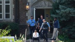 Minneapolis Mayor Jacob Frey sits on steps of the Annunciation Church's school as police response to a reported mass shooting, Wednesday, Aug. 27, 2025, in Minneapolis. (AP Photo/Abbie Parr)