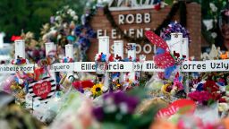 FILE - Crosses are surrounded by flowers and other mementos at a memorial, June 9, 2022, for the victims of a shooting at Robb Elementary School in Uvalde, Texas. (AP Photo/Eric Gay, File)