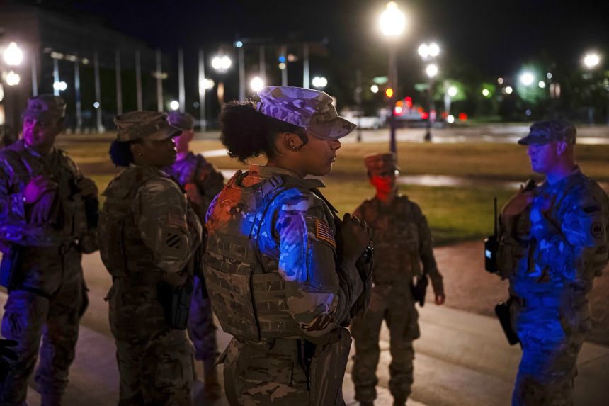 Members of the National Guard stand watch near Union Station in Washington, DC, on Wednesday, August 27, 2025.
