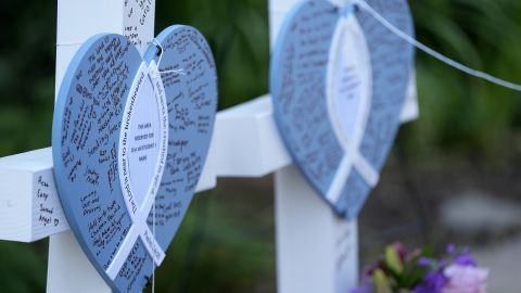 Written messages are left on hearts at a makeshift memorial at Annunciation Catholic Church after Wednesday's school shooting, Thursday, Aug. 28, 2025, in Minneapolis.