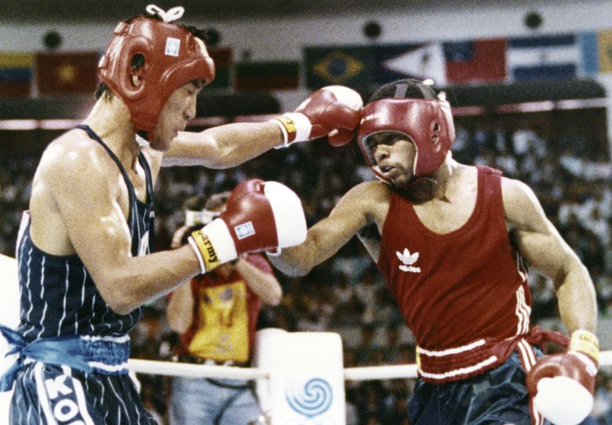 Park Si-hun (left) and Roy Jones Jr. trade jabs at the 1988 Olympics in Seoul.
