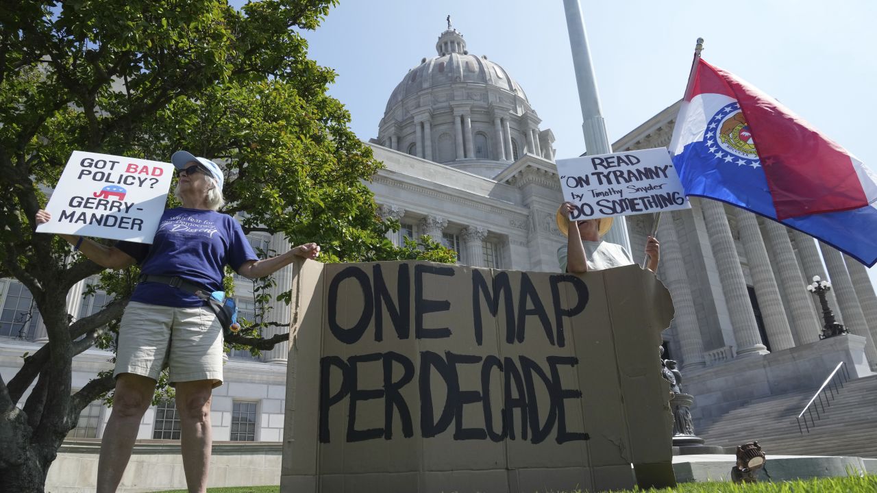 Robin Rothove, left, and Paula Smith, right, demonstrate outside the Missouri capitol as lawmakers prepare to conduct a committee hearing inside to consider redrawing the state's US House districts, on Thursday, September 4, in Jefferson City, Missouri.