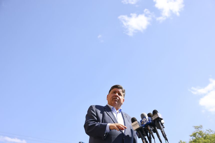 Gov. JB Pritzker speaks with reporters in Berwyn, Ill., on September 4. Pritzker wrote on X. “Donald Trump isn’t a strongman, he’s a scared man. Illinois won’t be intimidated by a wannabe dictator.”