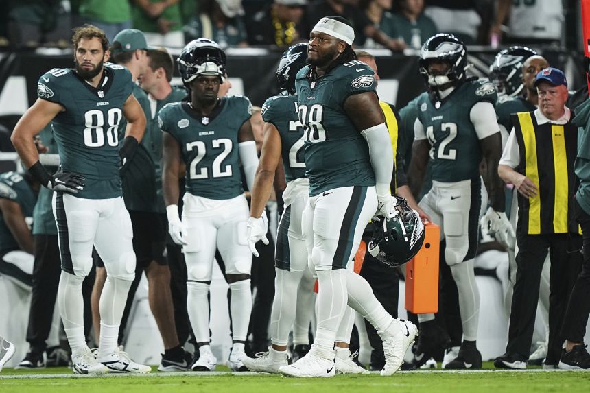 Carter (No. 98) apologized after being ejected for spitting at an opponent.