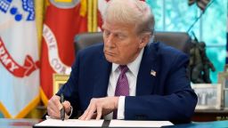 President Donald Trump signs an executive order in the Oval Office of the White House, Friday, September 5, 2025.