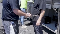 This image from video provided by U.S. Immigration and Customs Enforcement via DVIDS shows a person being handcuffed at the Hyundai Motor Group’s electric vehicle plant, in Ellabell, Georgia, on September 4, 2025.