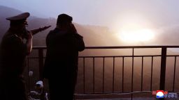 In this photo provided by the North Korean government, North Korean leader Kim Jong Un, right, watches a test of a new rocket engine at an undisclosed location, North Korea, Sep 8, 2025.