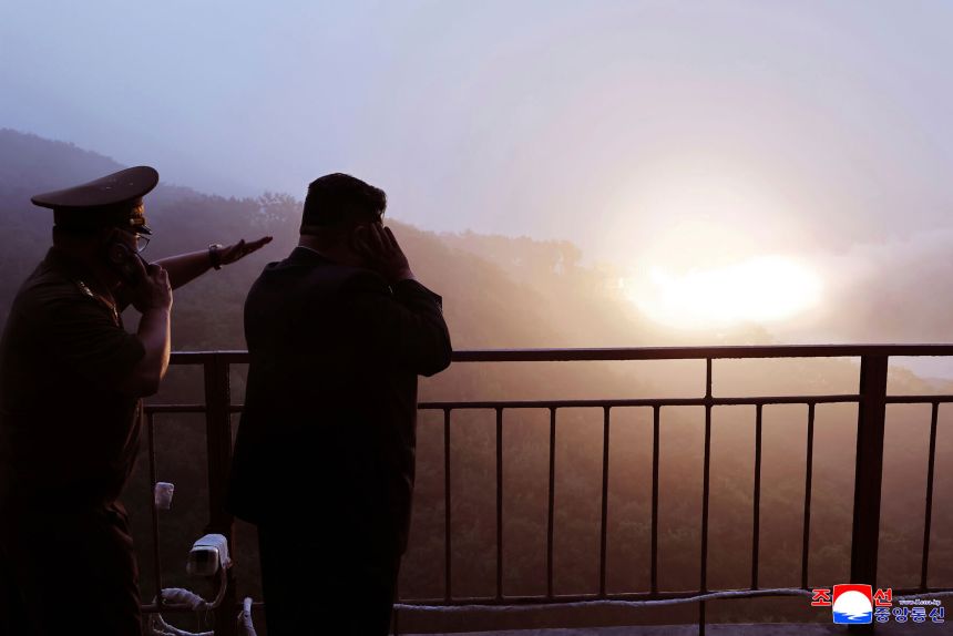 In this photo provided by the North Korean government, North Korean leader Kim Jong Un watches a test of a new rocket engine at an undisclosed location, North Korea, Sep 8, 2025.