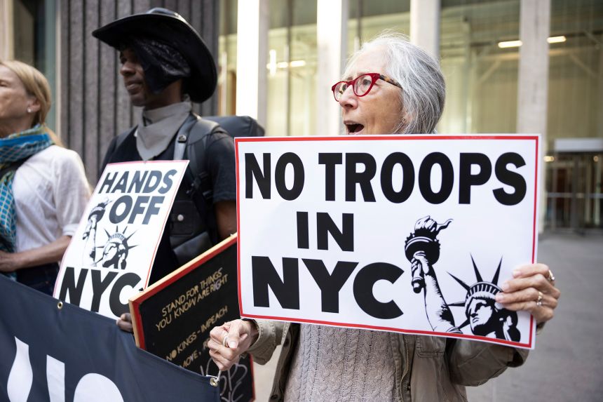 Protesters hold signs and chant in New York on September 9.
