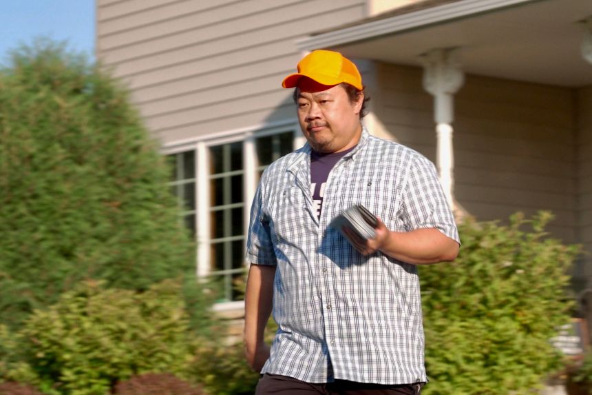 Xp Lee, Democratic candidate for the Minnesota House, knocks on doors while campaigning in Brooklyn Park, Minnesota, on September 11.