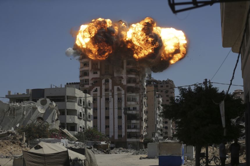 Flames erupt from a building following an Israeli military strike in Gaza City, Sunday, September 14, 2025.