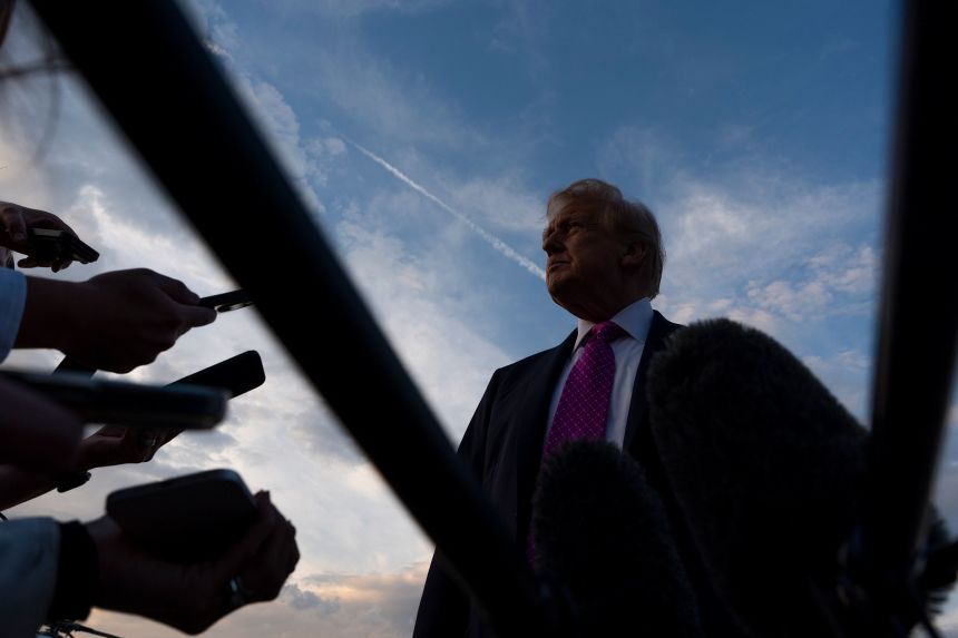 President Donald Trump speaks with reporters before he departs Morristown, New Jersey, on September 14.