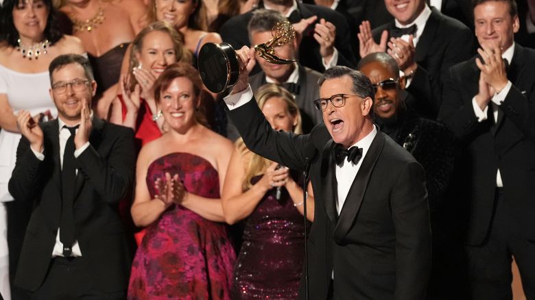 Stephen Colbert, center, and he team from "The Late Show with Stephen Colbert" accept the award for outstanding talk series during the 77th Primetime Emmy Awards on Sunday, Sept. 14, 2025, at the Peacock Theater in Los Angeles.