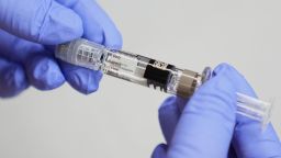 Clinic support supervisor May Fengmei Lin, CMA, displays a syringe of the Fluarix flu vaccine at International Community Health Services, Wednesday, Sept. 10, 2025, in Seattle. (AP Photo/Lindsey Wasson)