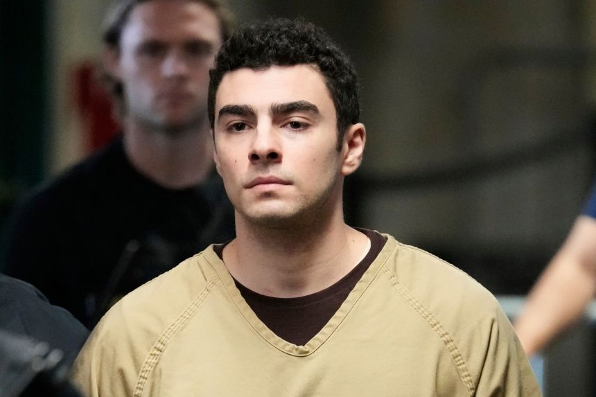 Luigi Mangione is escorted into Manhattan state court.