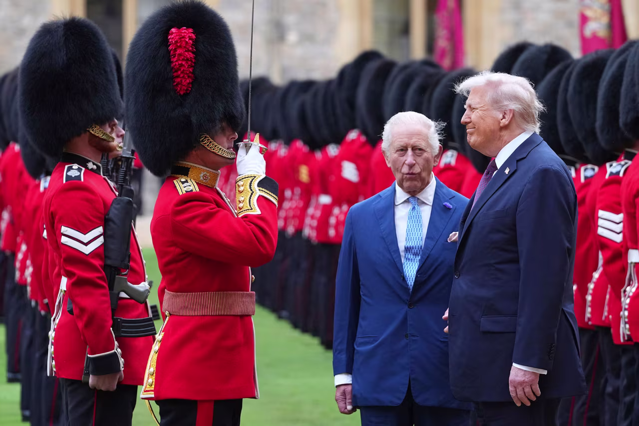 US President Donald Trump and Britain's King Charles III review the Guard of Honour after their arrival at Windsor Castle on Wednesday.