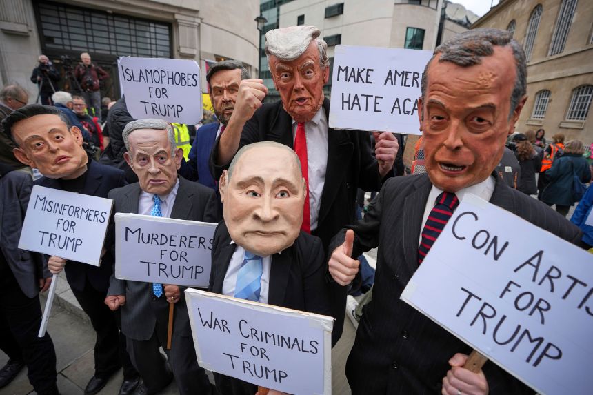 Protesters are wearing politicians' masks during a demonstration that has been suspended by Trump Union groups.
