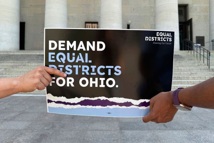 Organizers hold a sign outside of the Ohio Statehouse in Columbus, Ohio, advocating for an end to gerrymandering and for legislators to draw fair maps on September 17, 2025.