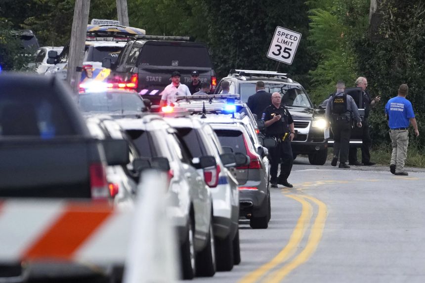 A long line of law enforcement vehicles are staged on the scene in North Codorus, Pennsylvania, where five people were shot.