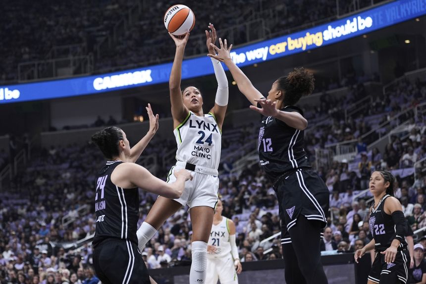 Minnesota Lynx forward Napheesa Collier shoots over Golden State Valkyries defenders in the WNBA basketball playoffs Wednesday, Sept. 17, 2025.