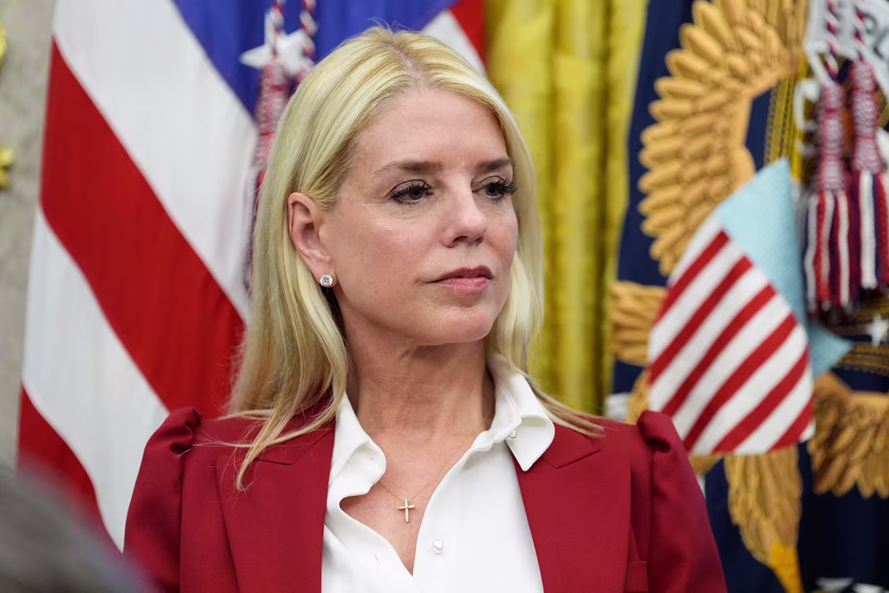 Attorney General Pam Bondi listens as President Donald Trump speaks in the Oval Office at the White House, on September 25.